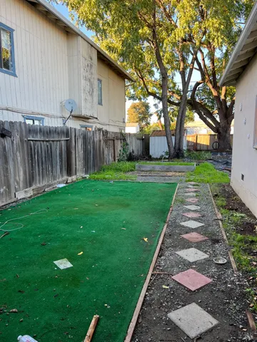 a view of a back yard of the house