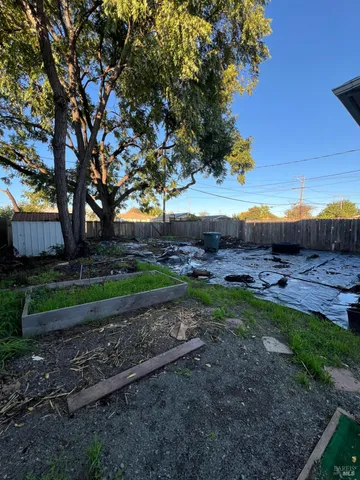 a view of a backyard with trees