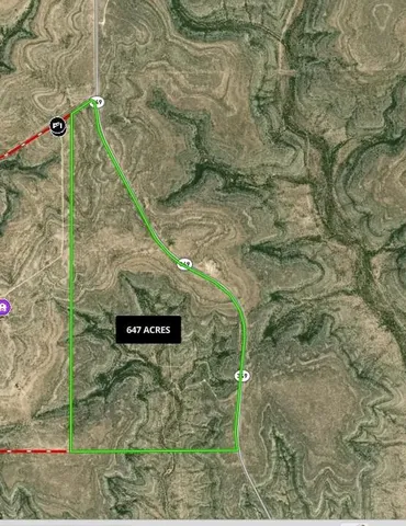 a sign that is sitting on a brick wall