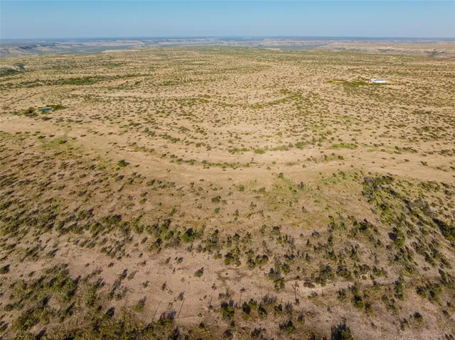 a view of beach with an ocean