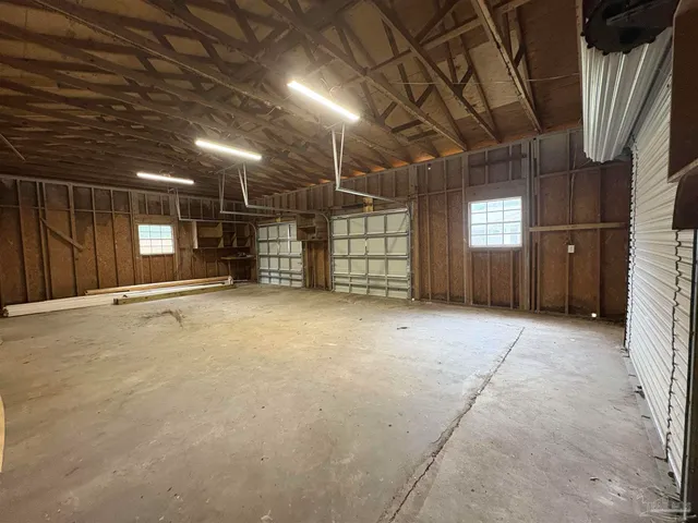 a view of empty room with wooden ceiling