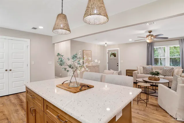 a living room with dining table and chairs