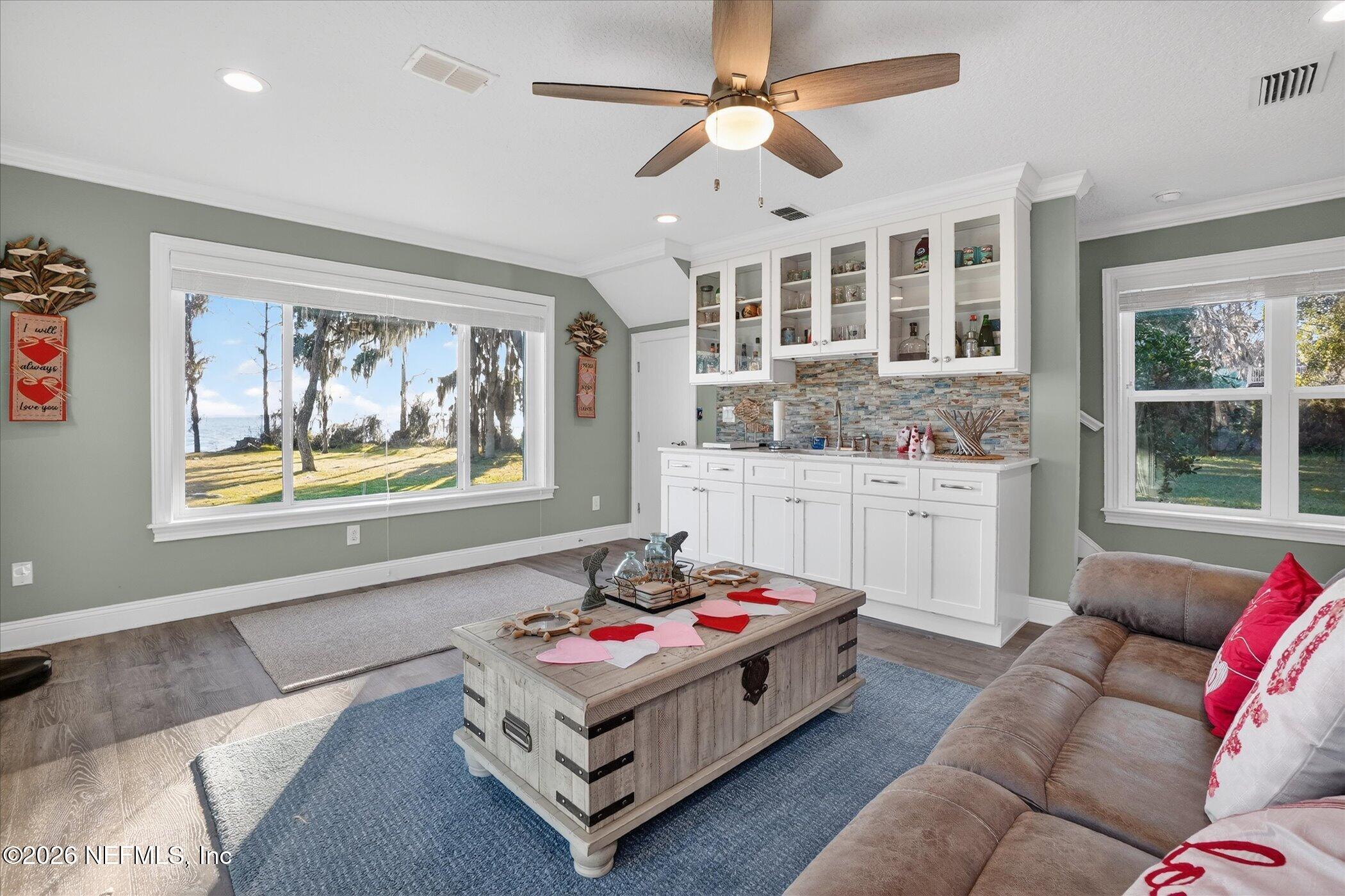 6447 Jack Wright Island Road St. Augustine, FL 32092 - Photo 16 of 37 a living room with furniture and window