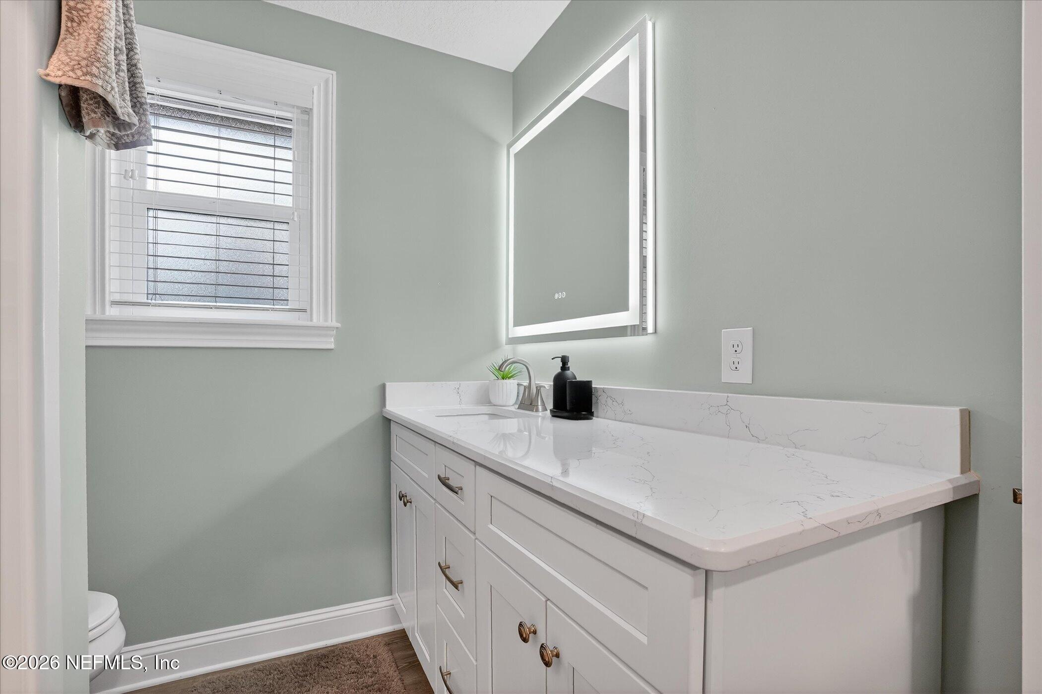 6447 Jack Wright Island Road St. Augustine, FL 32092 - Photo 22 of 37 a bathroom with a sink and a vanity