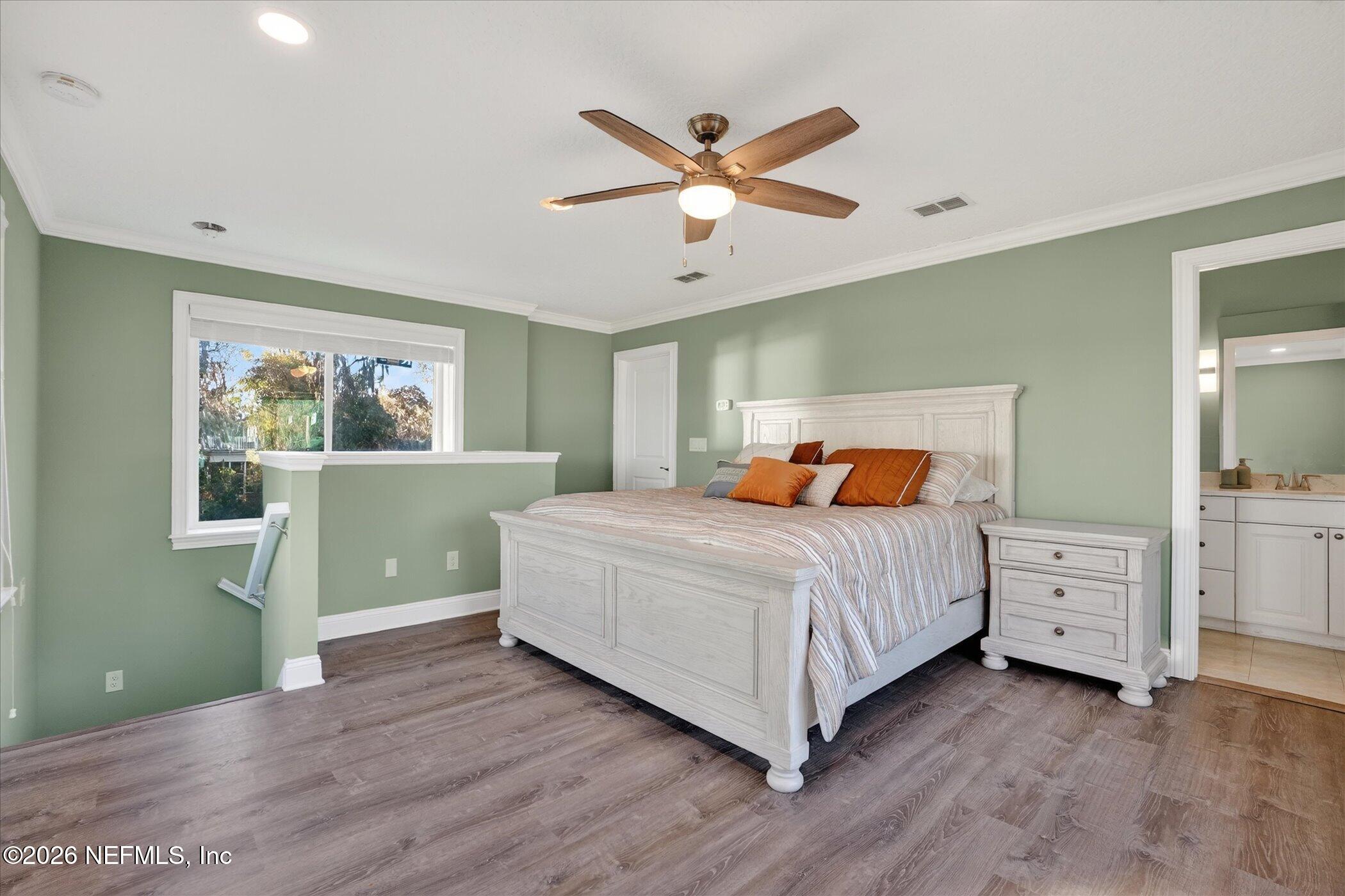 6447 Jack Wright Island Road St. Augustine, FL 32092 - Photo 24 of 37 a bedroom with a bed and a window