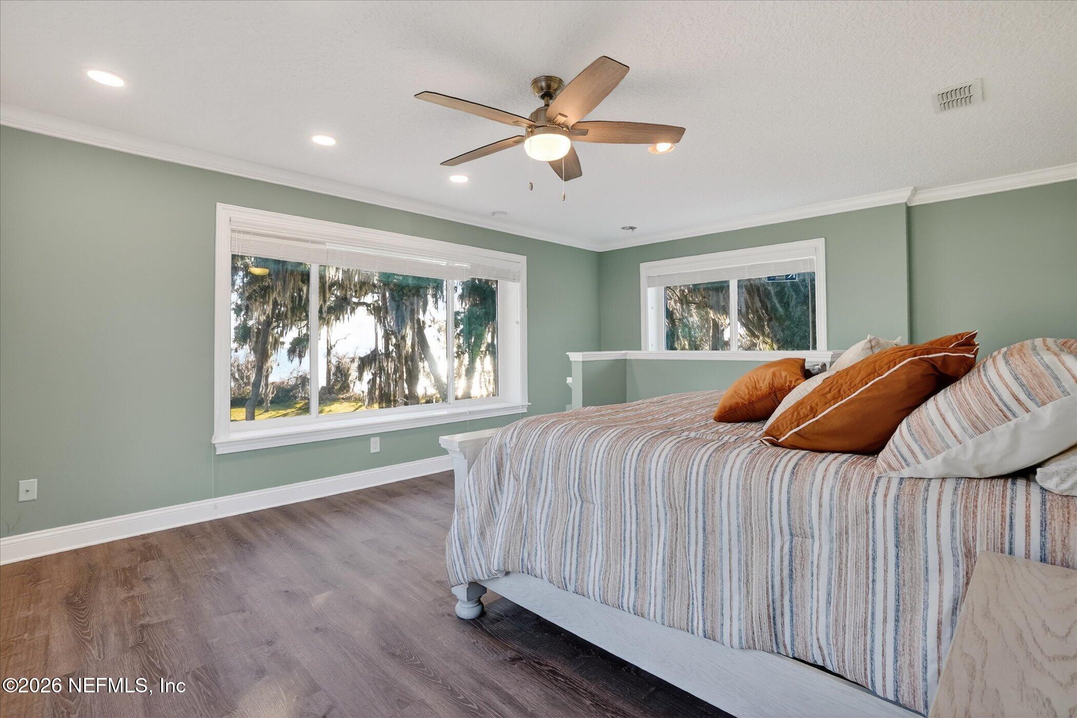 6447 Jack Wright Island Road St. Augustine, FL 32092 - Photo 25 of 37 a bedroom with a bed and window