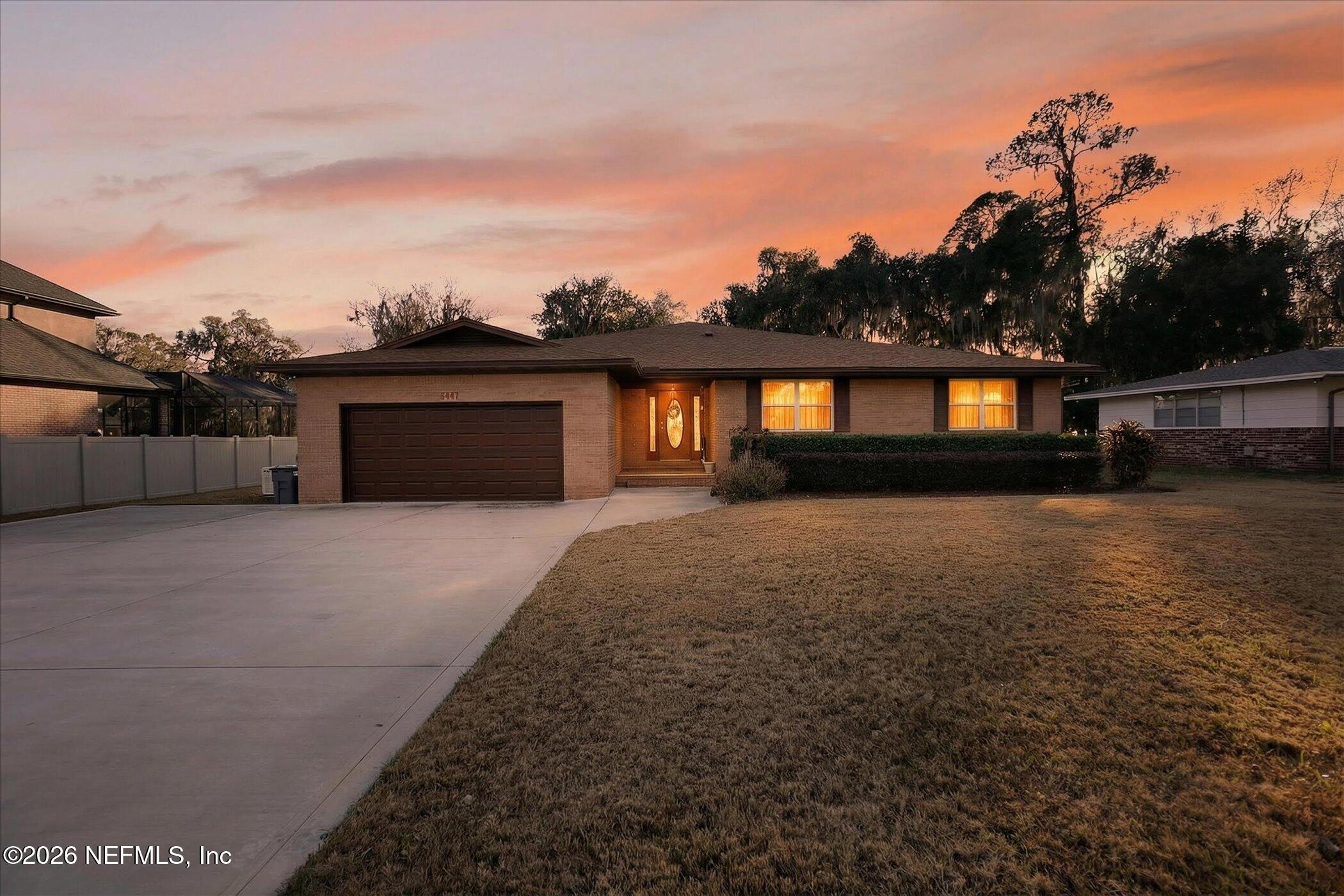 6447 Jack Wright Island Road St. Augustine, FL 32092 - Photo 3 of 37 a front view of a house with a yard