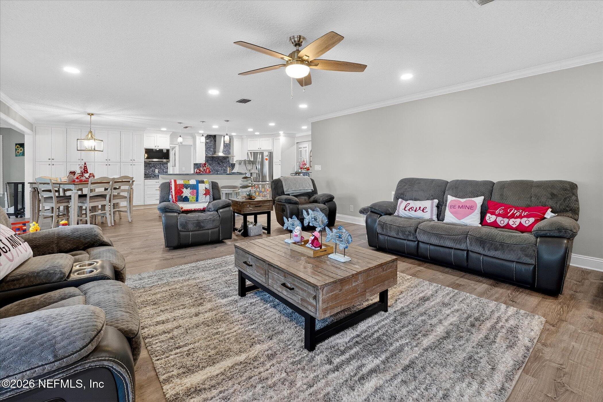 6447 Jack Wright Island Road St. Augustine, FL 32092 - Photo 8 of 37 a living room with furniture and a rug