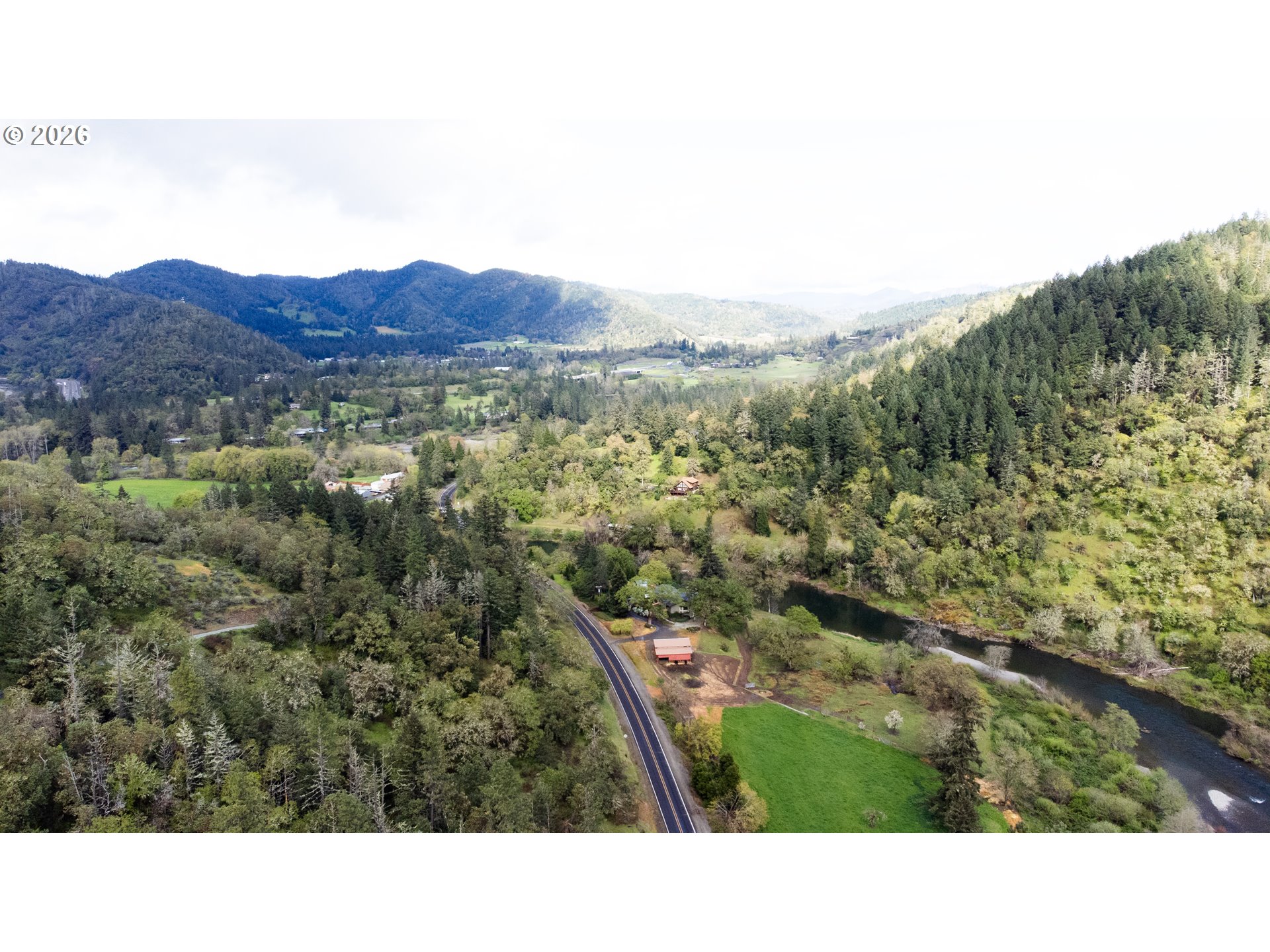 119 Winter Green Drive Riddle, OR 97469 - Photo 13 of 24 a open area with mountains in the background