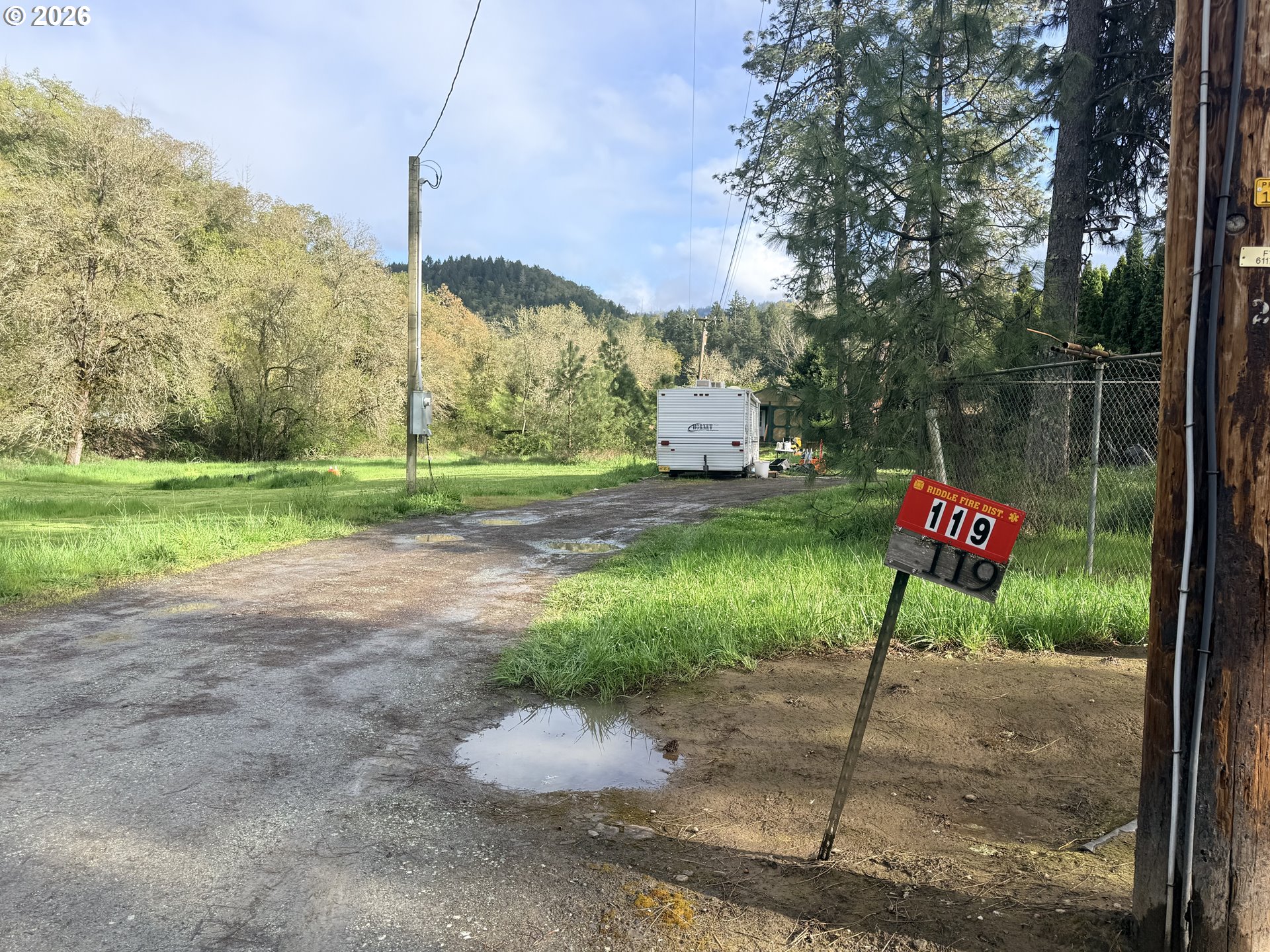 119 Winter Green Drive Riddle, OR 97469 - Photo 24 of 24 a flag is sitting in the middle of a yard