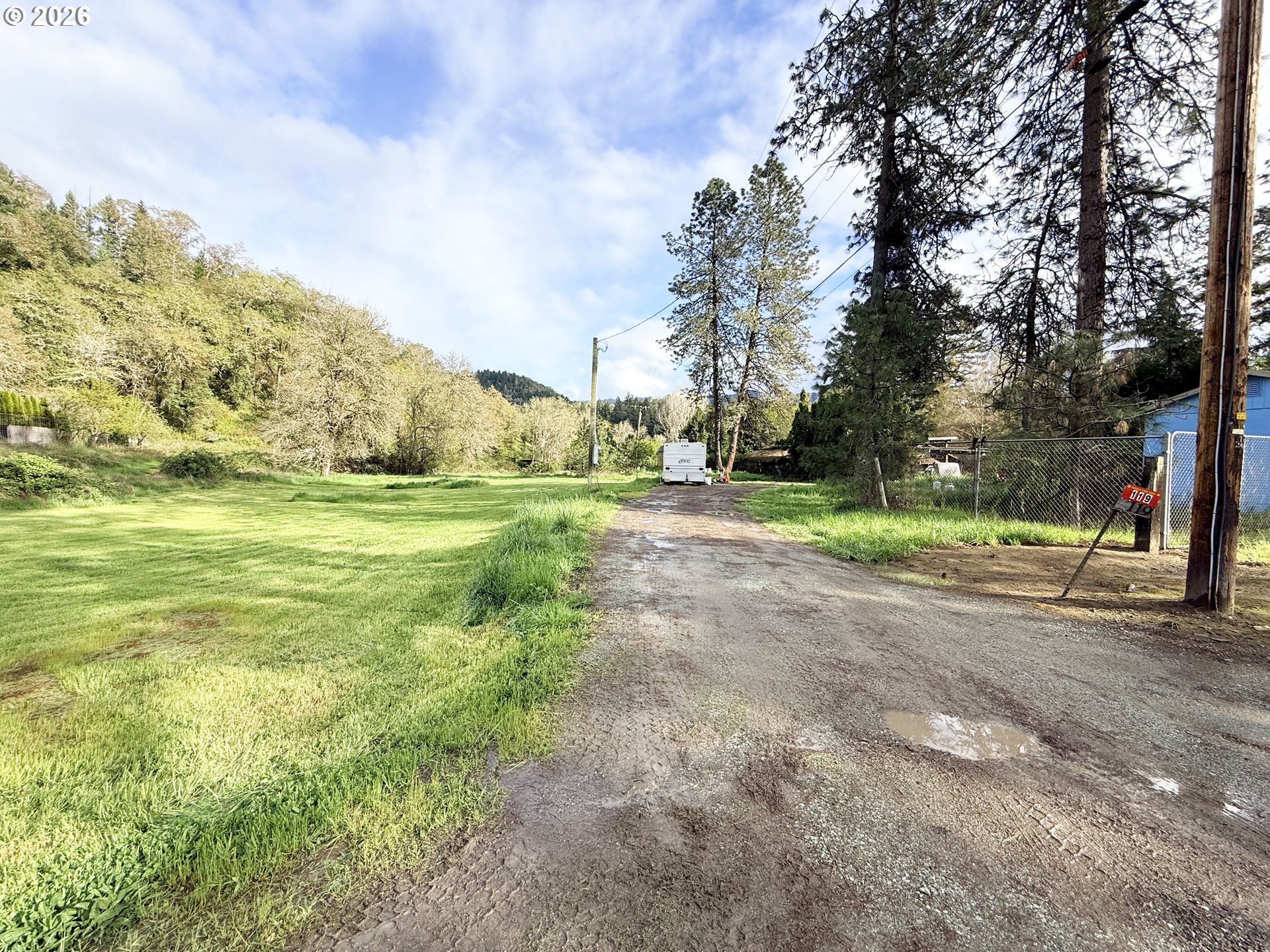 119 Winter Green Drive Riddle, OR 97469 - Photo 5 of 24 a view of a yard with a house