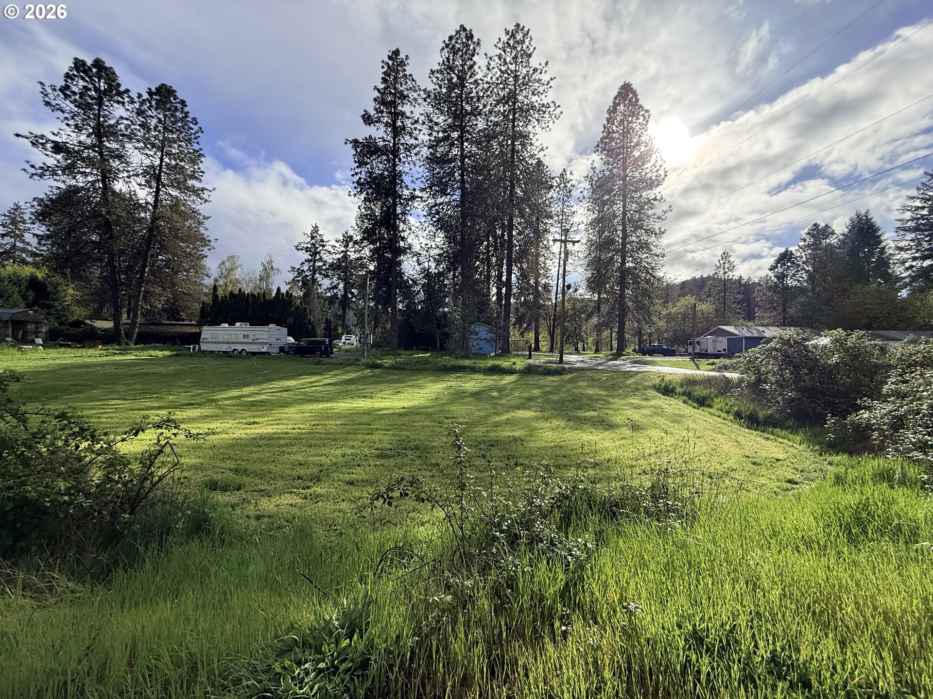 119 Winter Green Drive Riddle, OR 97469 - Photo 7 of 24 a view of a golf course with a lake