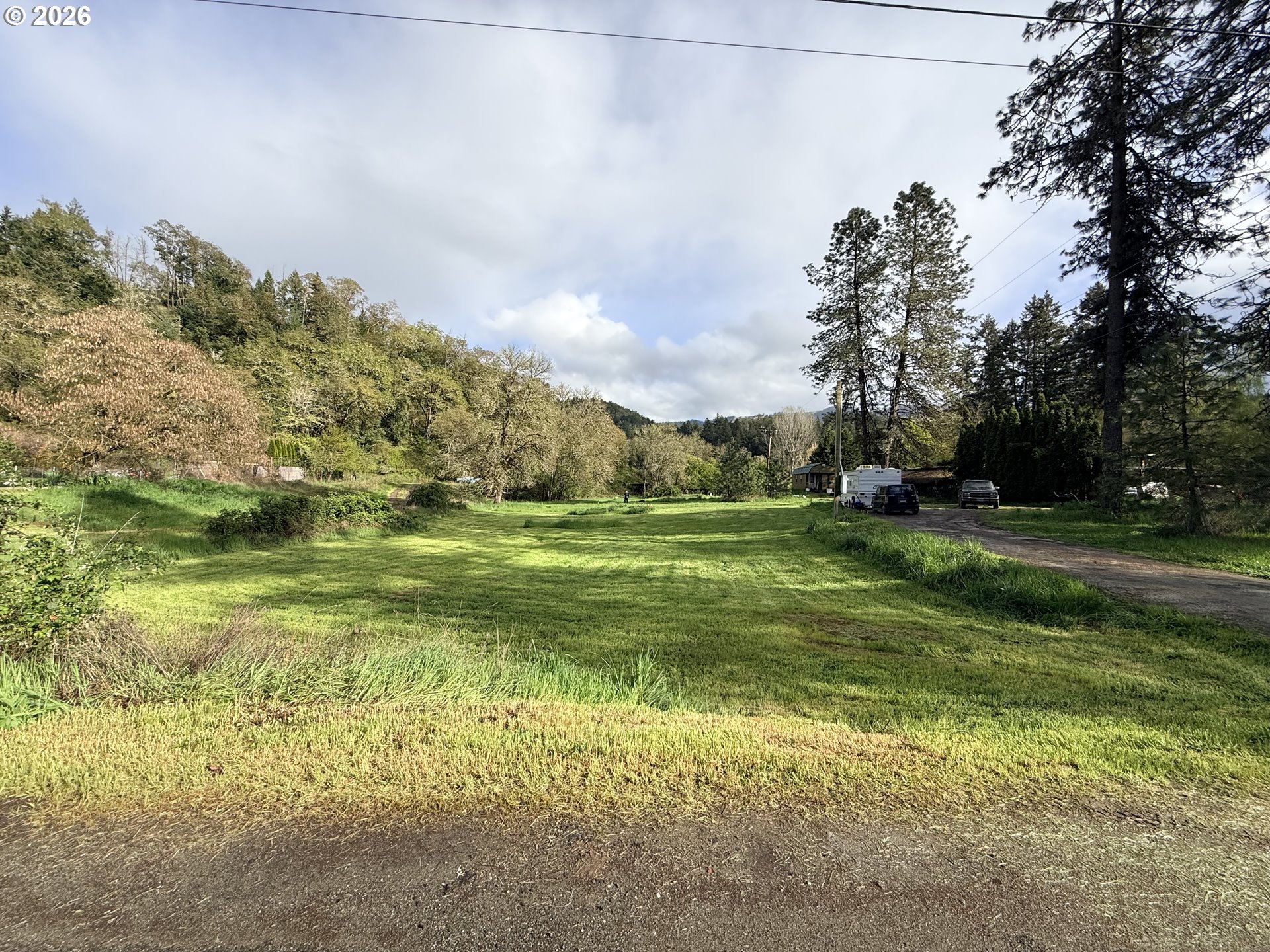119 Winter Green Drive Riddle, OR 97469 - Photo 8 of 24 a view of a field with an trees