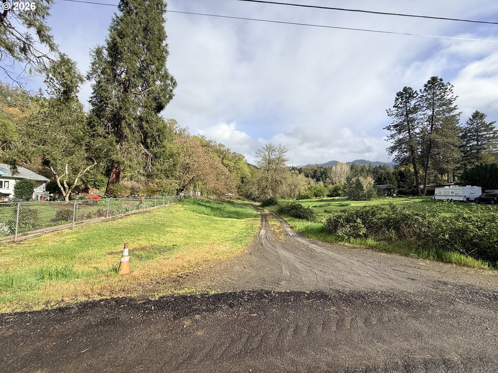 119 Winter Green Drive Riddle, OR 97469 - Photo 10 of 24 a view of a yard with an trees