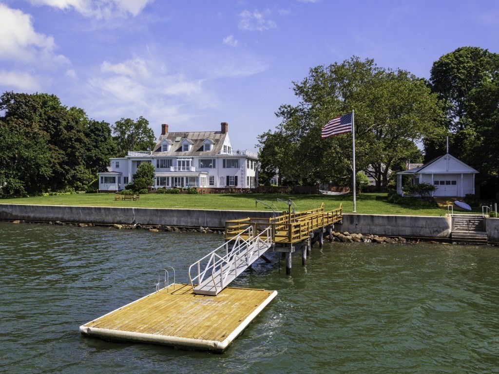 an aerial view of a house with a garden and swimming pool