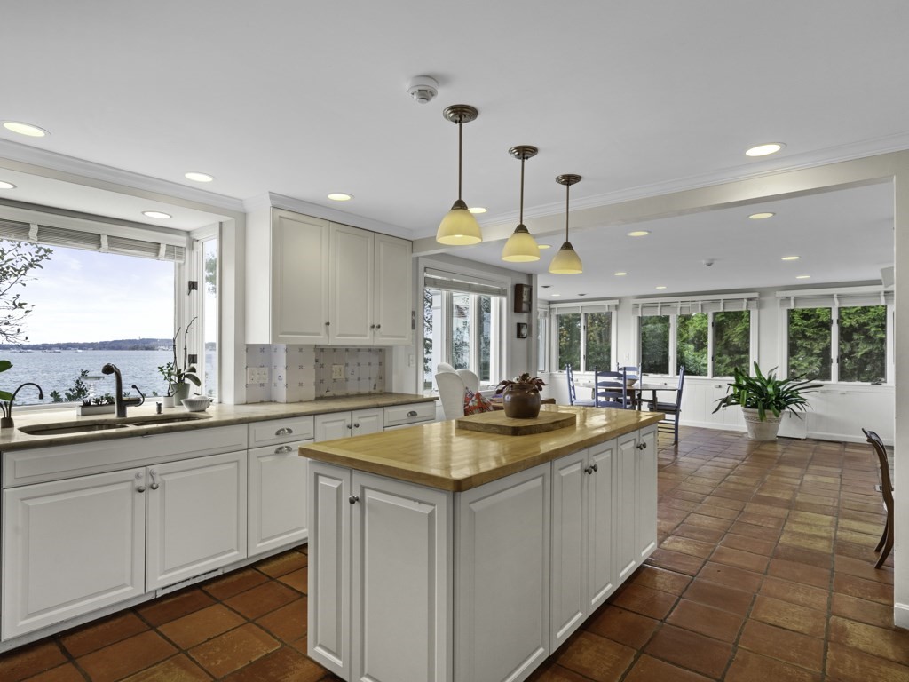 247 King Caesar Road Duxbury, MA 02332 - Photo 13 of 38 a kitchen with a sink and white cabinets