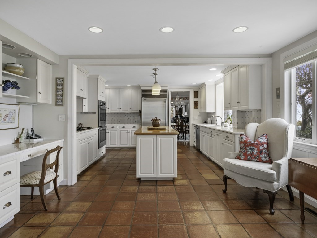 247 King Caesar Road Duxbury, MA 02332 - Photo 16 of 38 a kitchen with stainless steel appliances kitchen island granite countertop a sink and cabinets