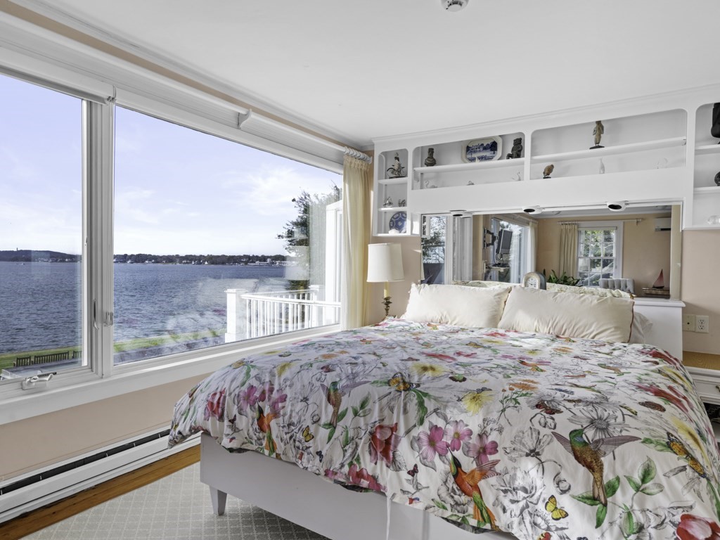 247 King Caesar Road Duxbury, MA 02332 - Photo 24 of 38 a bed sitting in a bedroom next to a window