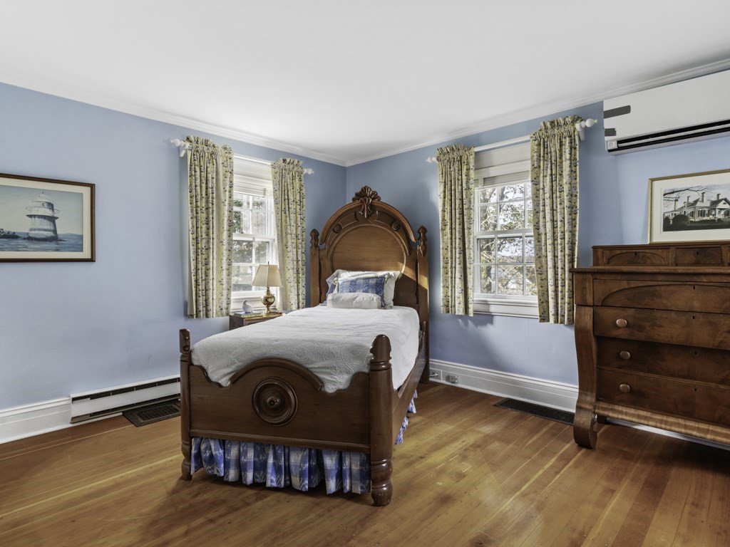 247 King Caesar Road Duxbury, MA 02332 - Photo 30 of 38 a bedroom with a bed and wooden floor