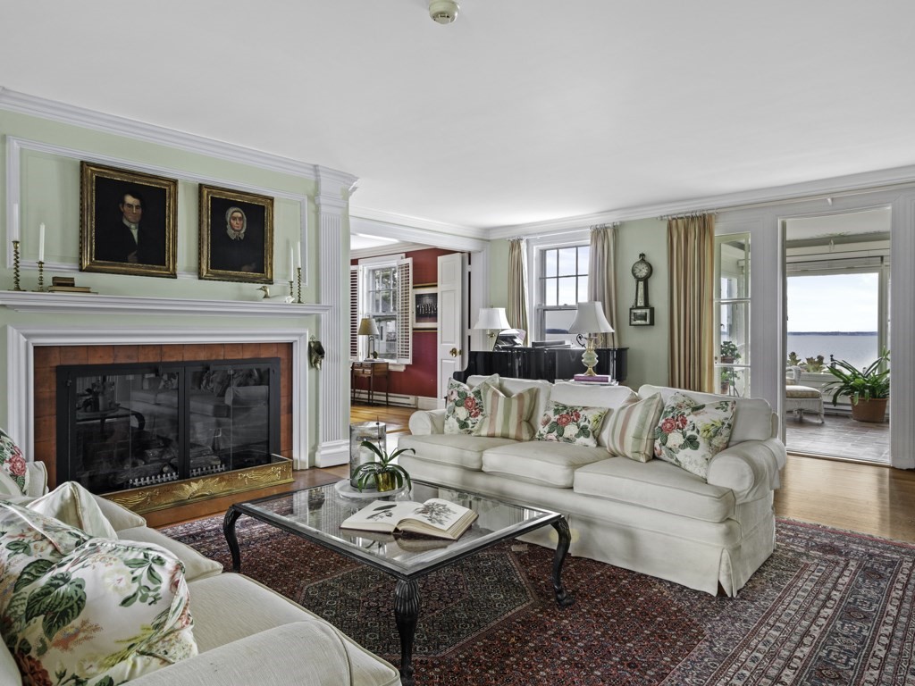 247 King Caesar Road Duxbury, MA 02332 - Photo 4 of 38 a living room with furniture and a fireplace