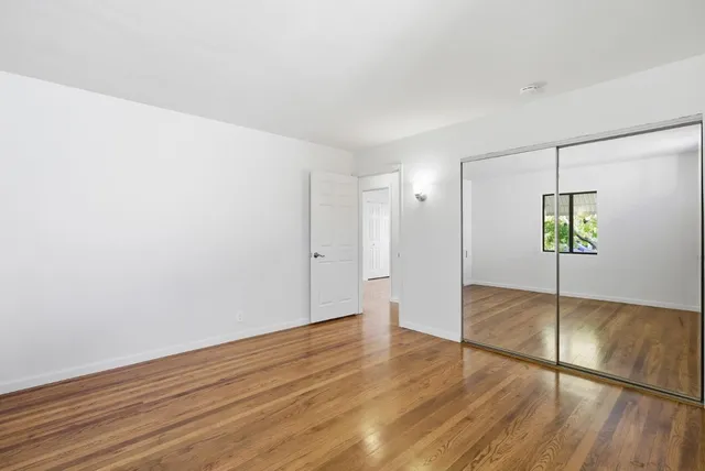 a kitchen with a sink cabinets and window