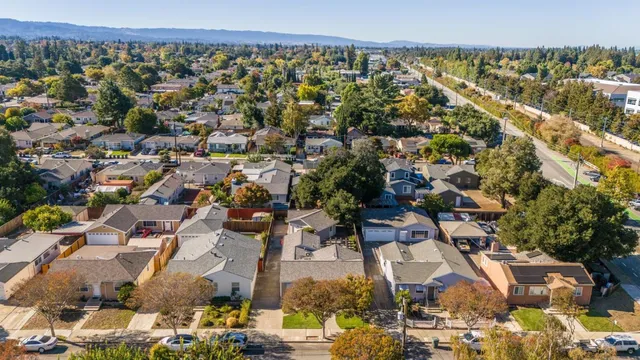 a picture of a bench in front of a wall