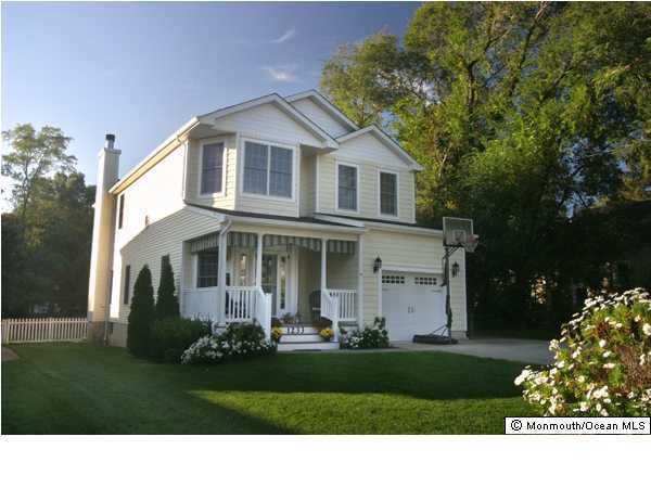 1233 Crosby Road Spring Lake Heights, NJ 07762 - Photo 1 of 3 a front view of a house with a yard and trees