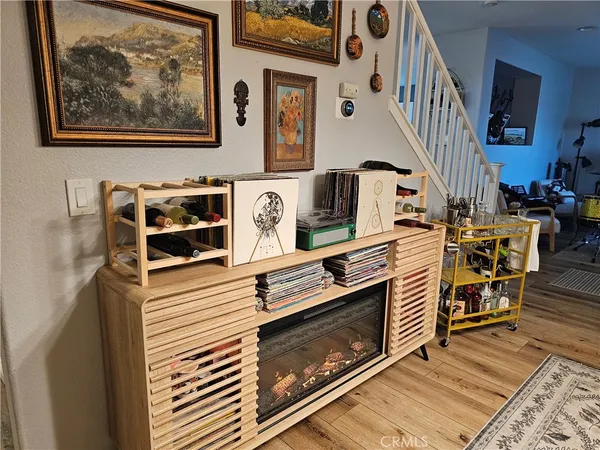 a view of a fireplace with furniture and rug