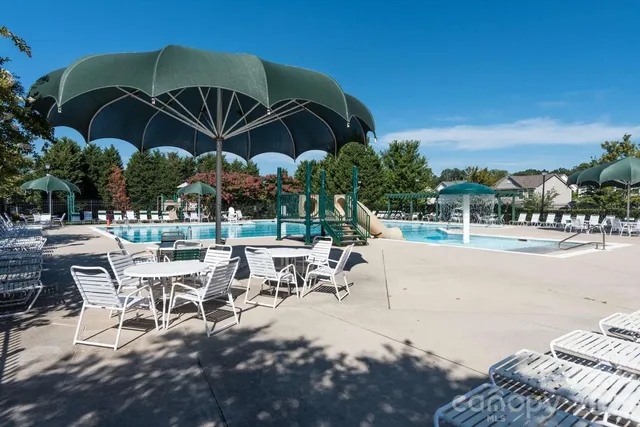 a view of a swimming pool with a patio