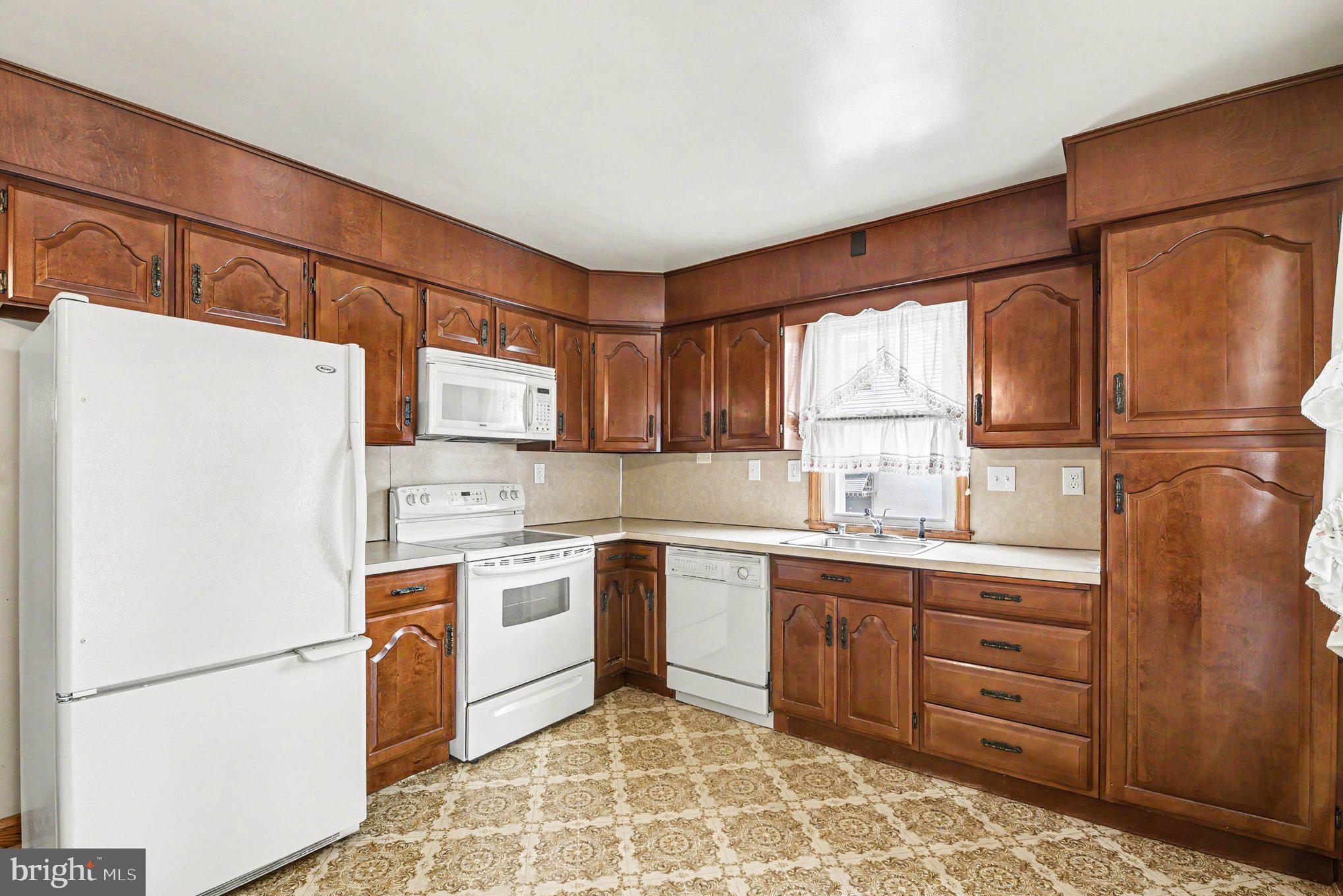 4125 Cliffvale Road Nottingham, MD 21236 - Photo 19 of 24 Charming kitchen with classic wood cabinetry.