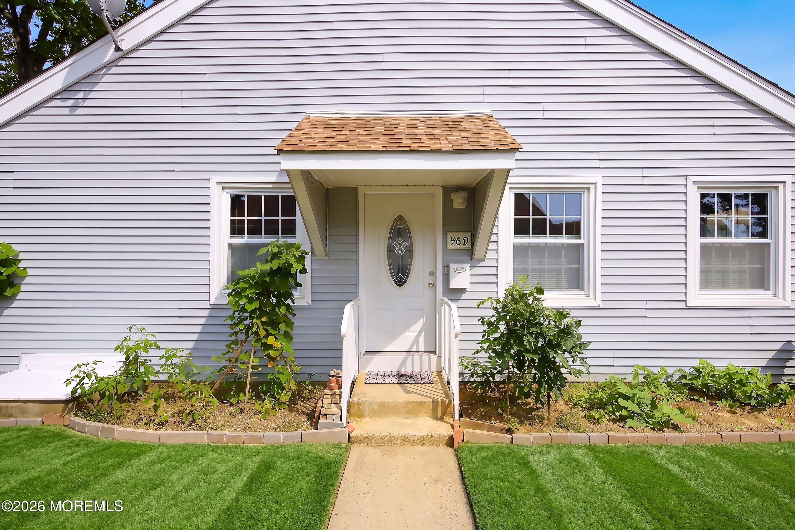 96 Halls Croft Road, Unit D Freehold, NJ 07728 - Photo 3 of 27 06-Entrance grass