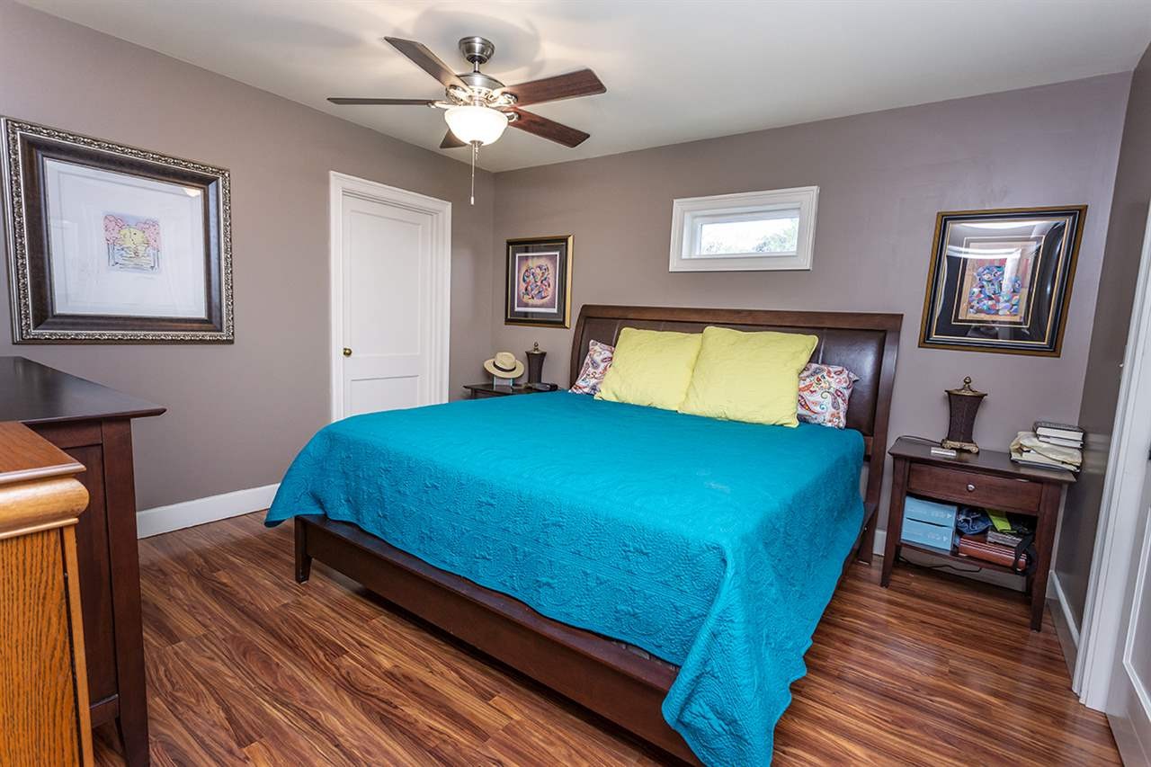 304 Georgetown Road Northwest Cleveland, TN 37311 - Photo 26 of 45 a bed room with a bed and a chandelier