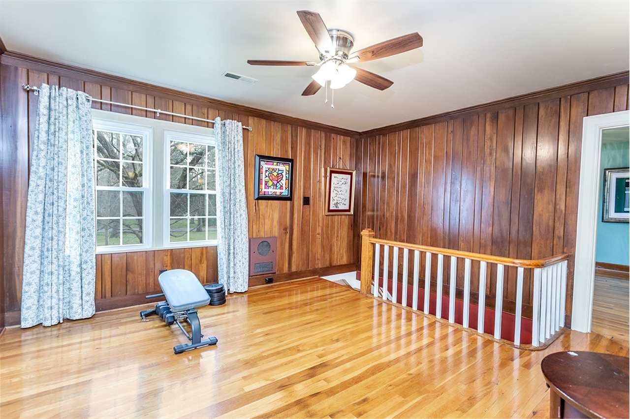 304 Georgetown Road Northwest Cleveland, TN 37311 - Photo 32 of 45 a living room with furniture and a floor to ceiling window