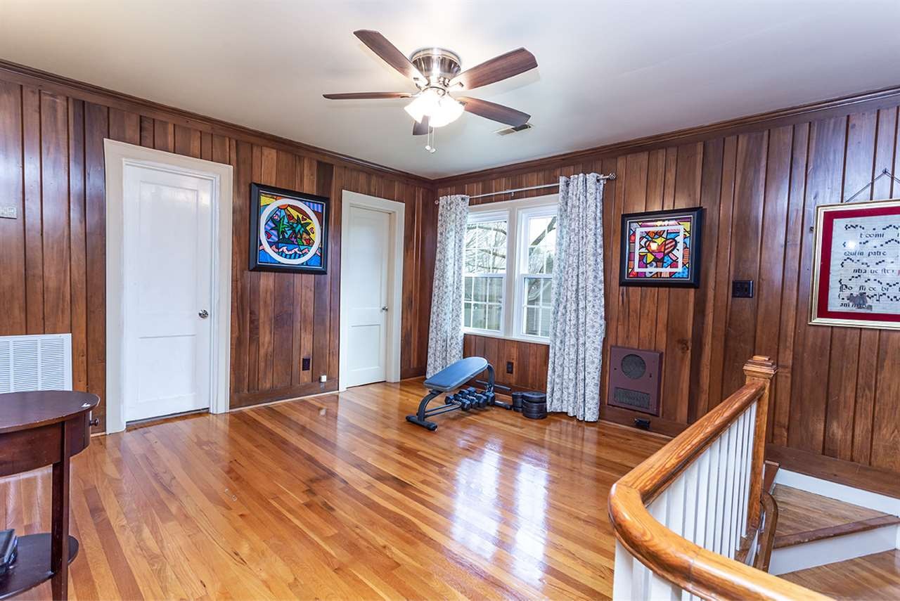 304 Georgetown Road Northwest Cleveland, TN 37311 - Photo 39 of 45 a bed room with a bed and a chandelier