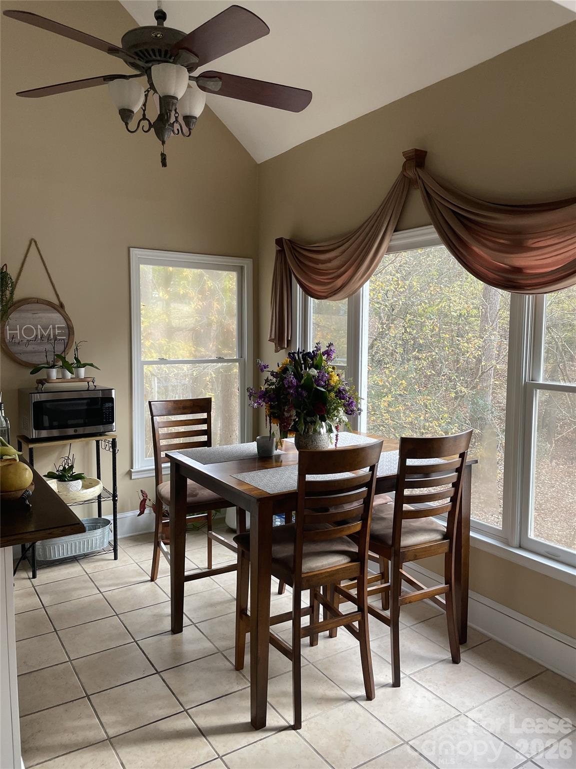 3800 Oldfield Road Charlotte, NC 28226 - Photo 5 of 32 a view of a dining room with furniture and a window