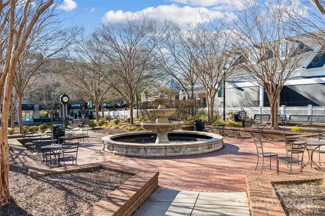 a view of a backyard with sitting area