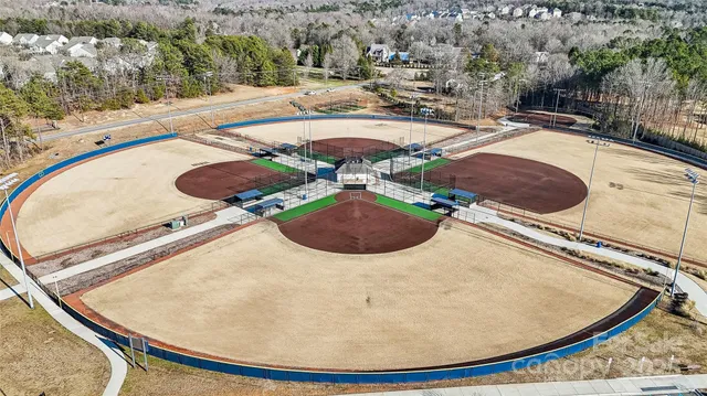 a view of a swimming pool with outdoor seating