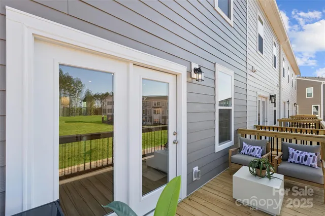 a front view of a house with outdoor seating