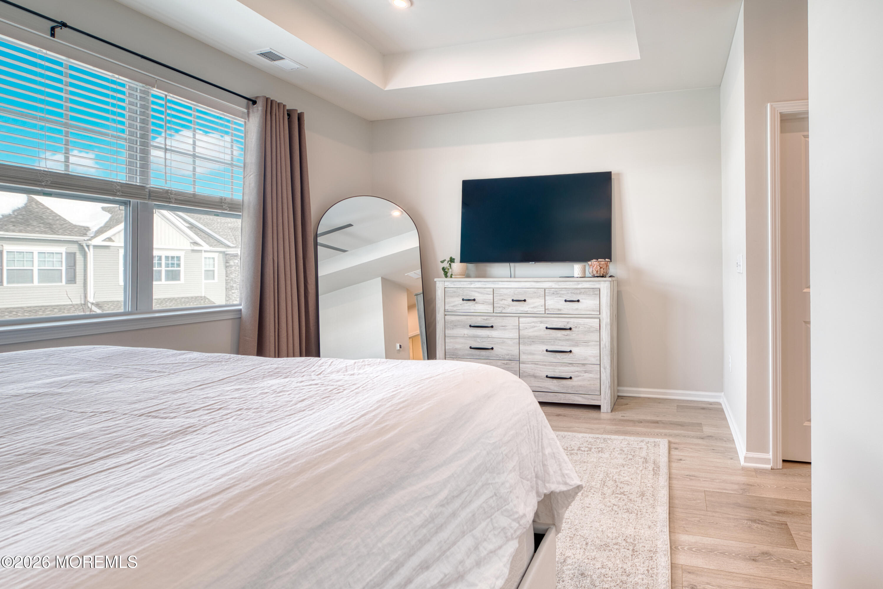 8 Laird Way Neptune, NJ 07753 - Photo 13 of 23 a bedroom with a bed and a flat screen tv