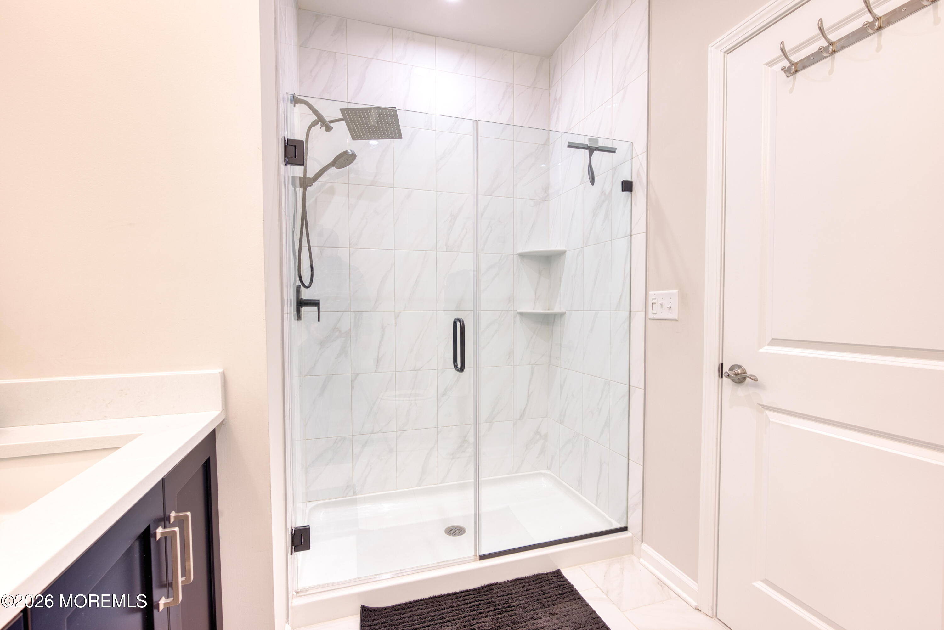 8 Laird Way Neptune, NJ 07753 - Photo 14 of 23 a bathroom with a shower and a glass door