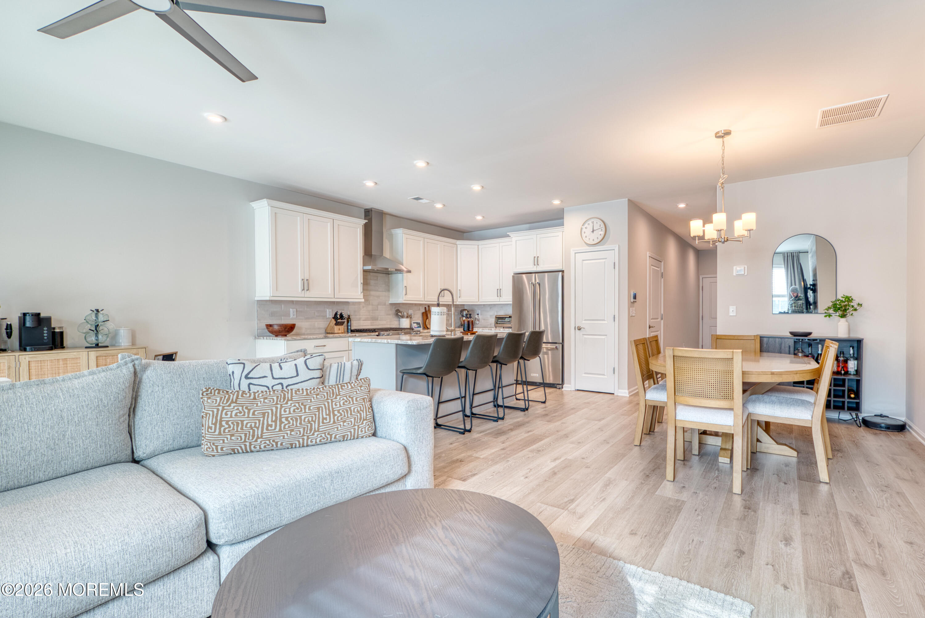8 Laird Way Neptune, NJ 07753 - Photo 9 of 23 a living room with furniture kitchen view and a chandelier