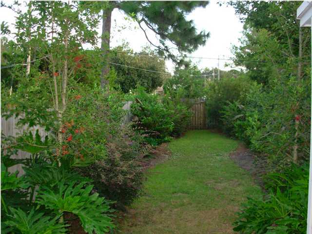 44 Berwick Circle, Unit 2 Shalimar, FL 32579 - Photo 2 of 12 a view of a yard with a tree