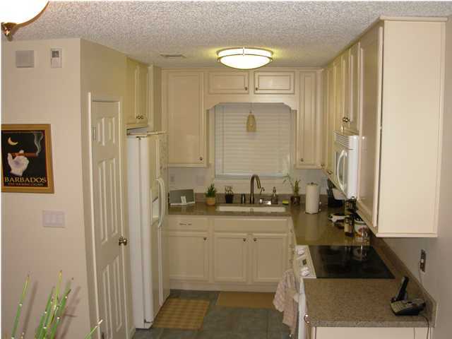 44 Berwick Circle, Unit 2 Shalimar, FL 32579 - Photo 6 of 12 a bathroom with a sink and a mirror