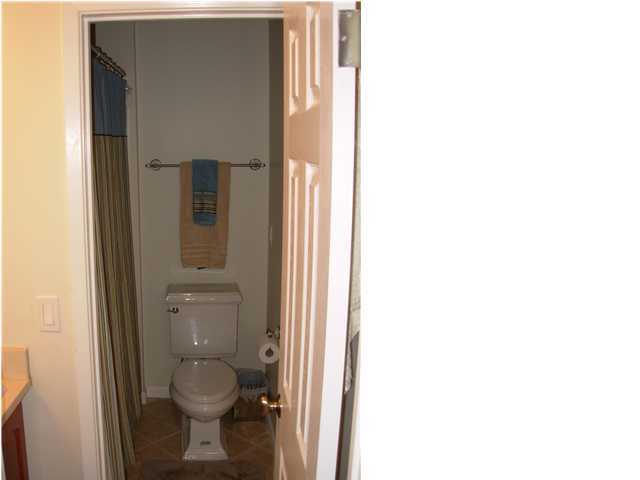 44 Berwick Circle, Unit 2 Shalimar, FL 32579 - Photo 8 of 12 a bathroom with a toilet and a shower