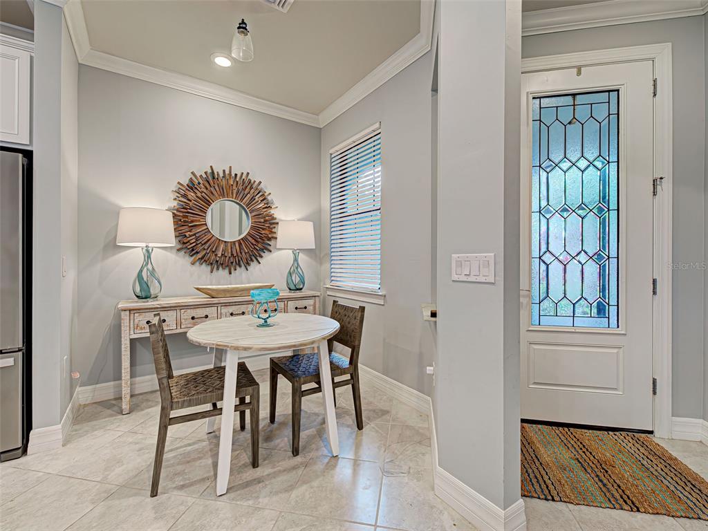 13836 Campoleone Street Venice, FL 34293 - Photo 13 of 99 a dining room with furniture and window