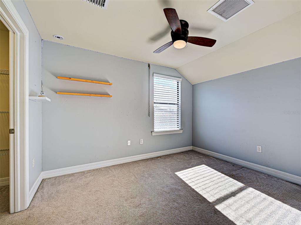 13836 Campoleone Street Venice, FL 34293 - Photo 37 of 99 a view of room with window and ceiling fan