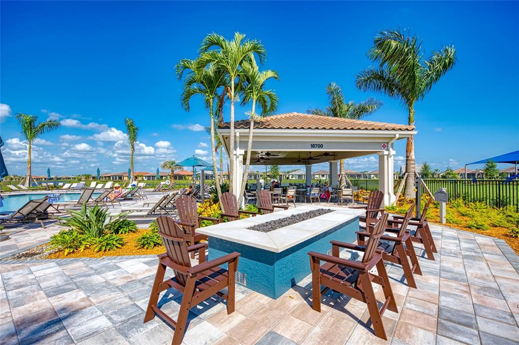 13836 Campoleone Street Venice, FL 34293 - Photo 68 of 99 a view of a chairs and table in a patio