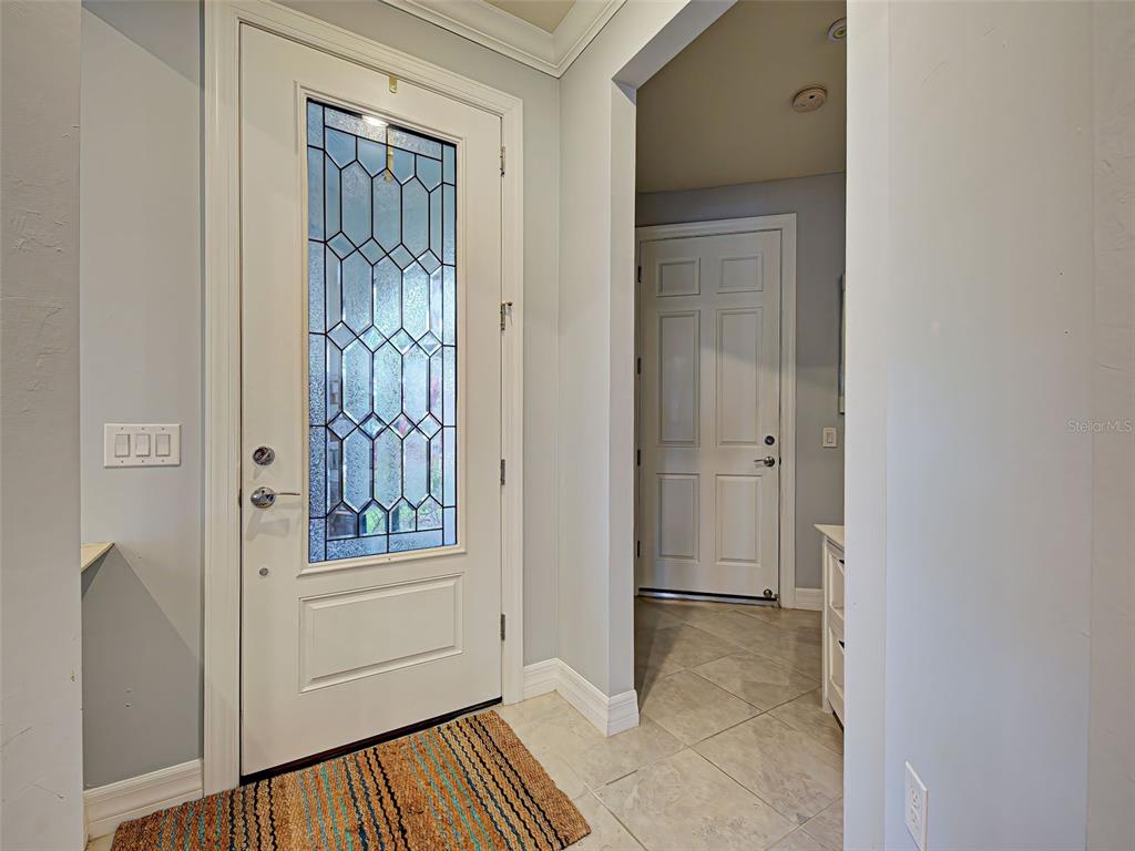 13836 Campoleone Street Venice, FL 34293 - Photo 7 of 99 a view of a hallway with a door and stairs