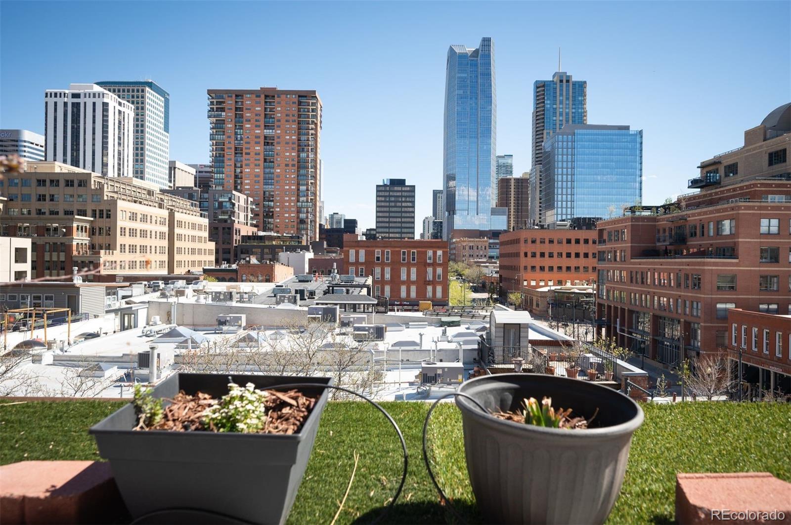 1501 Wazee Street, Unit 4B Denver, CO 80202 - Photo 30 of 49 a large building with a lot of plants and chairs