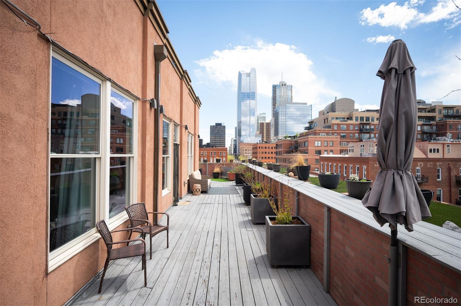 1501 Wazee Street, Unit 4B Denver, CO 80202 - Photo 49 of 49 a view of balcony with seating space and wooden floor